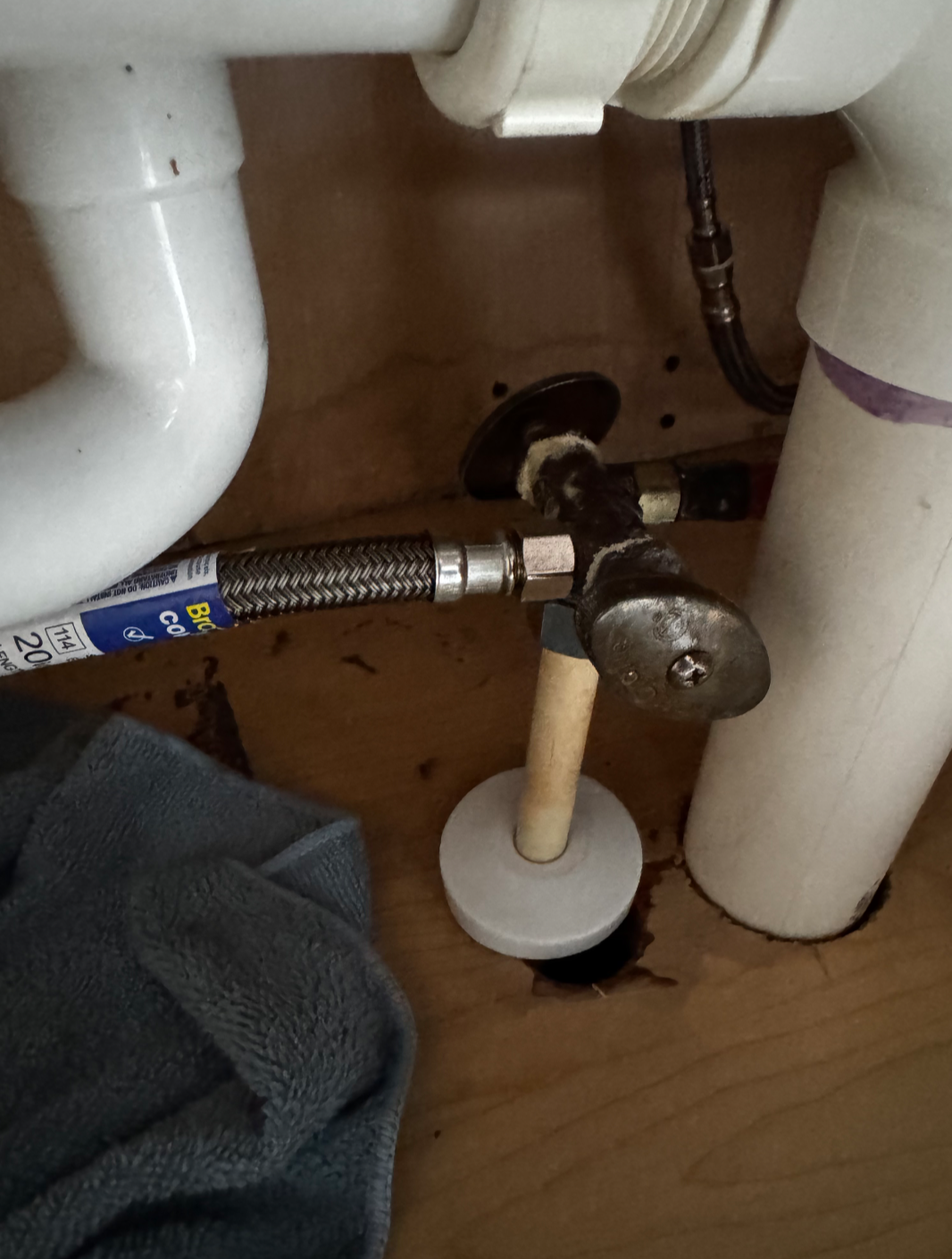 Bathroom sink plumbing pipes overhead view